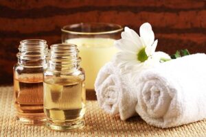 Candles, oils and towels – massage or aromatherapy